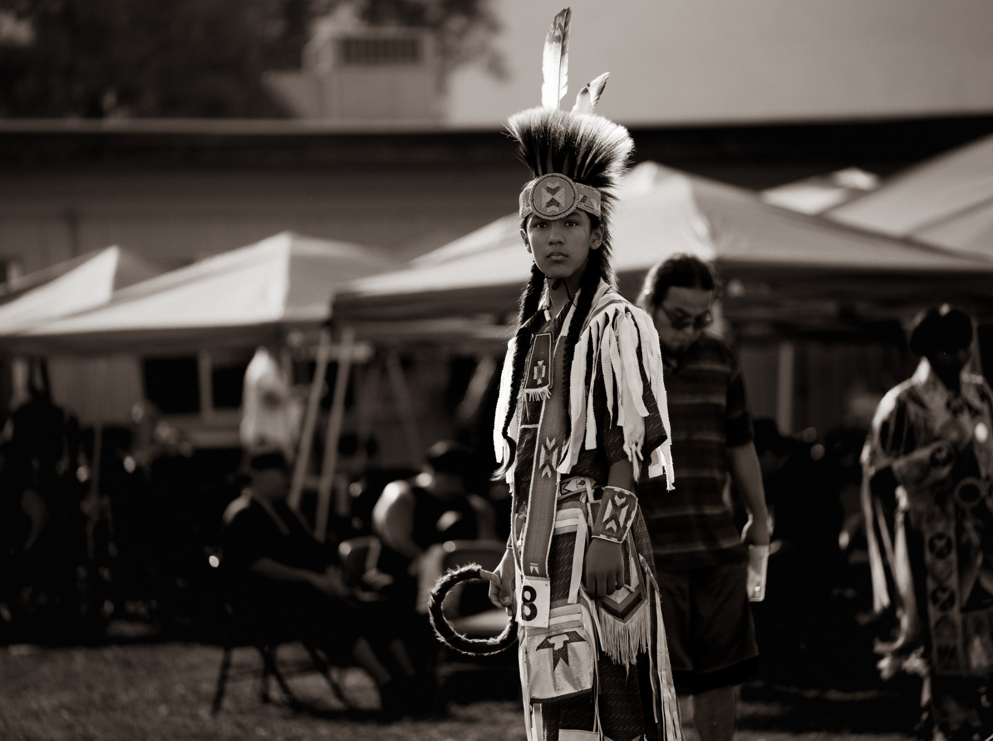 A dancer in regalia at Chief Lookingglass