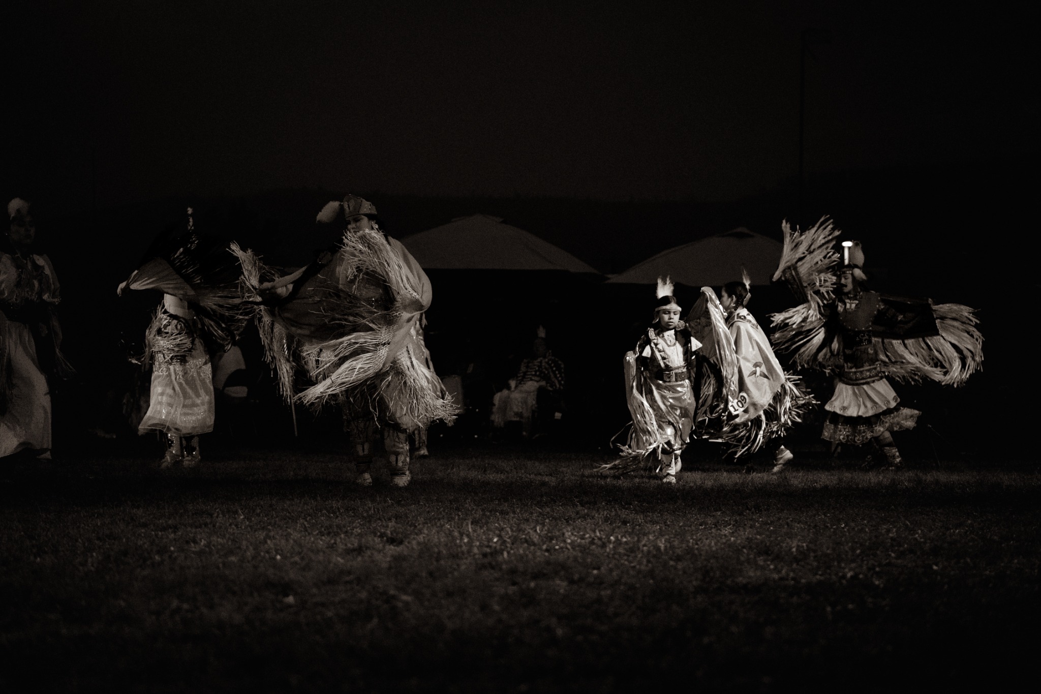 Dancers moving together at night